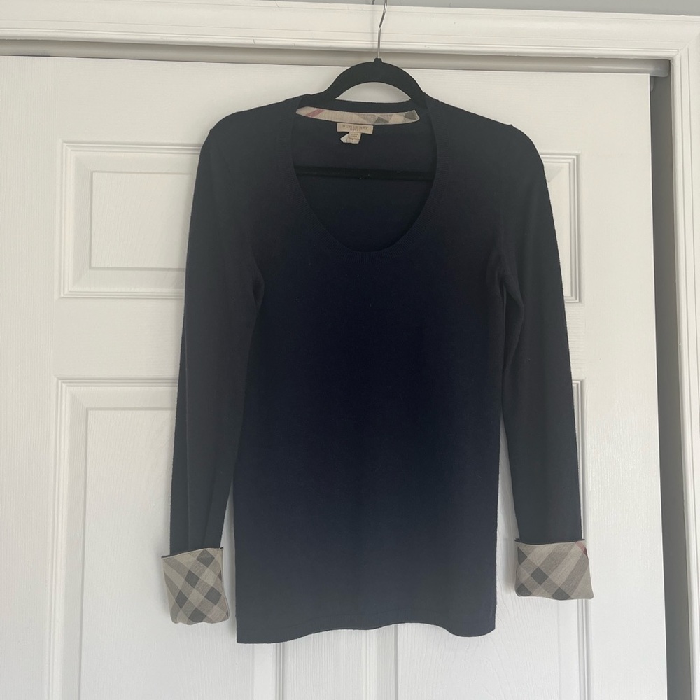 Authentic Burberry deep dip crew sweater with Burberry check at bottom sleeves.